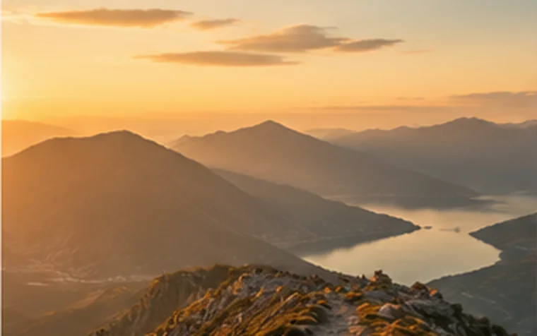 Mountain ridge overlooking a lake at sunset